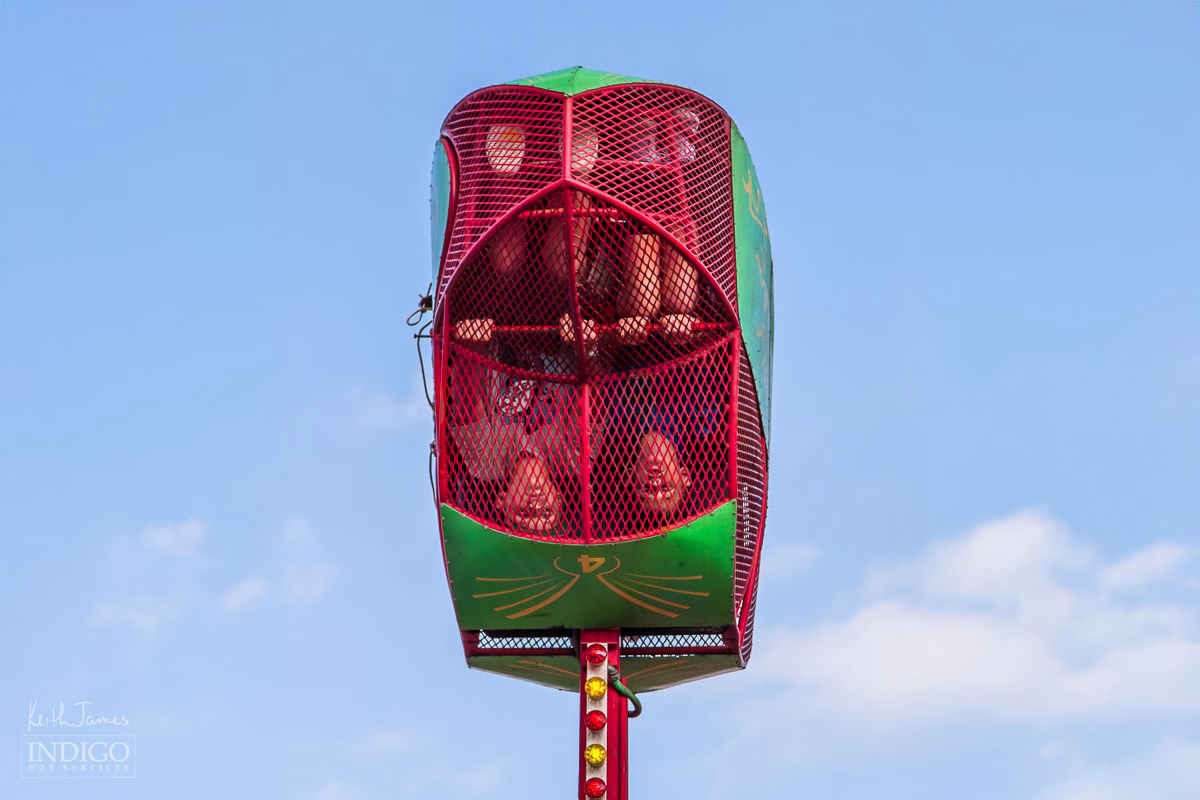 Two boys upside-down in a ride at Corn School in LaGrange, Indiana.