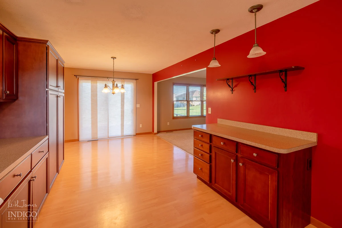 Real estate photo showing kitchen and dining area.