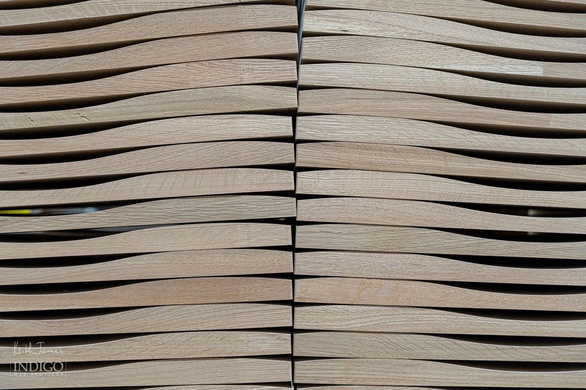 Abstract image of stacked wood used for chairs.