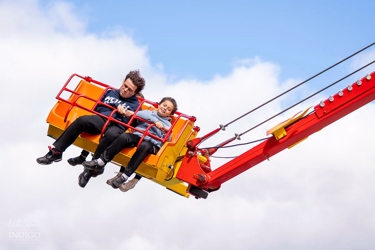 Two boys on a carnival ride at Corn School in LaGrange, Indiana.