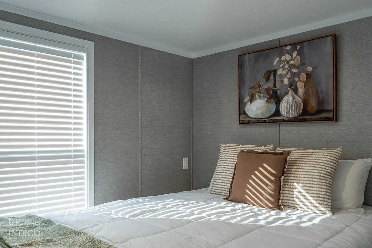 Sales brochure photo of the bedroom area of a park model RV.