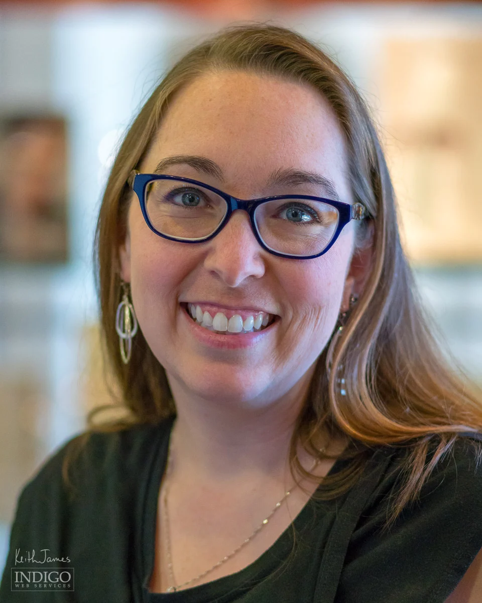 Portrait of a female technician at an optometry office.